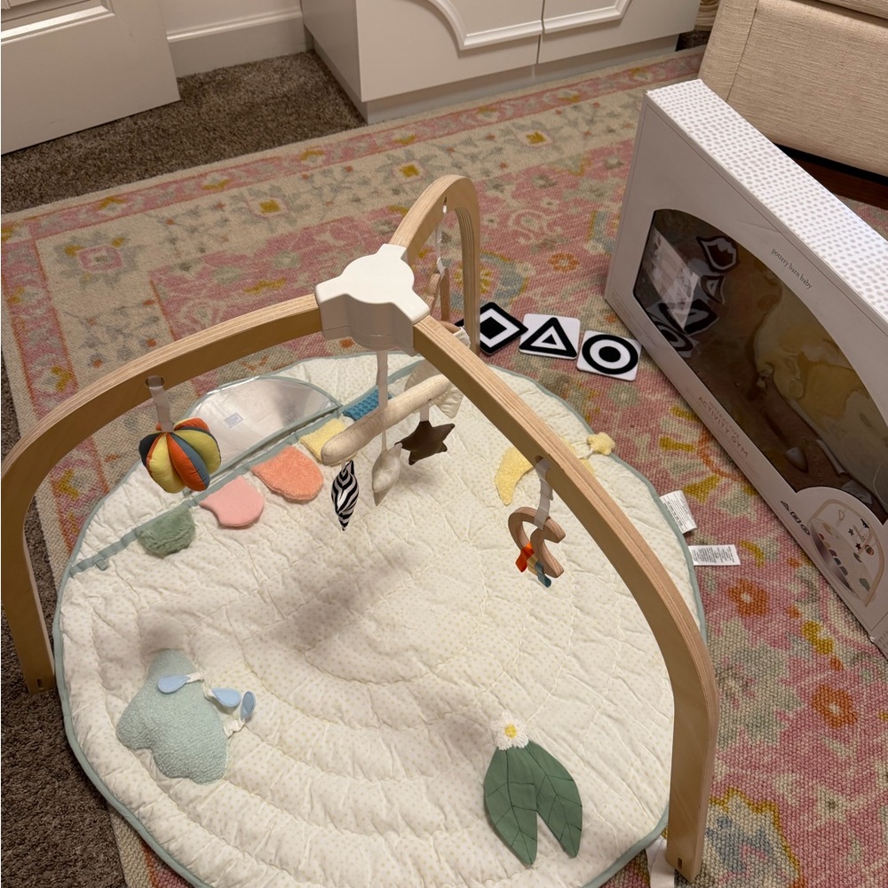 Pottery Barn Wooden Play Gym with Cream Mat and Colorful Toys